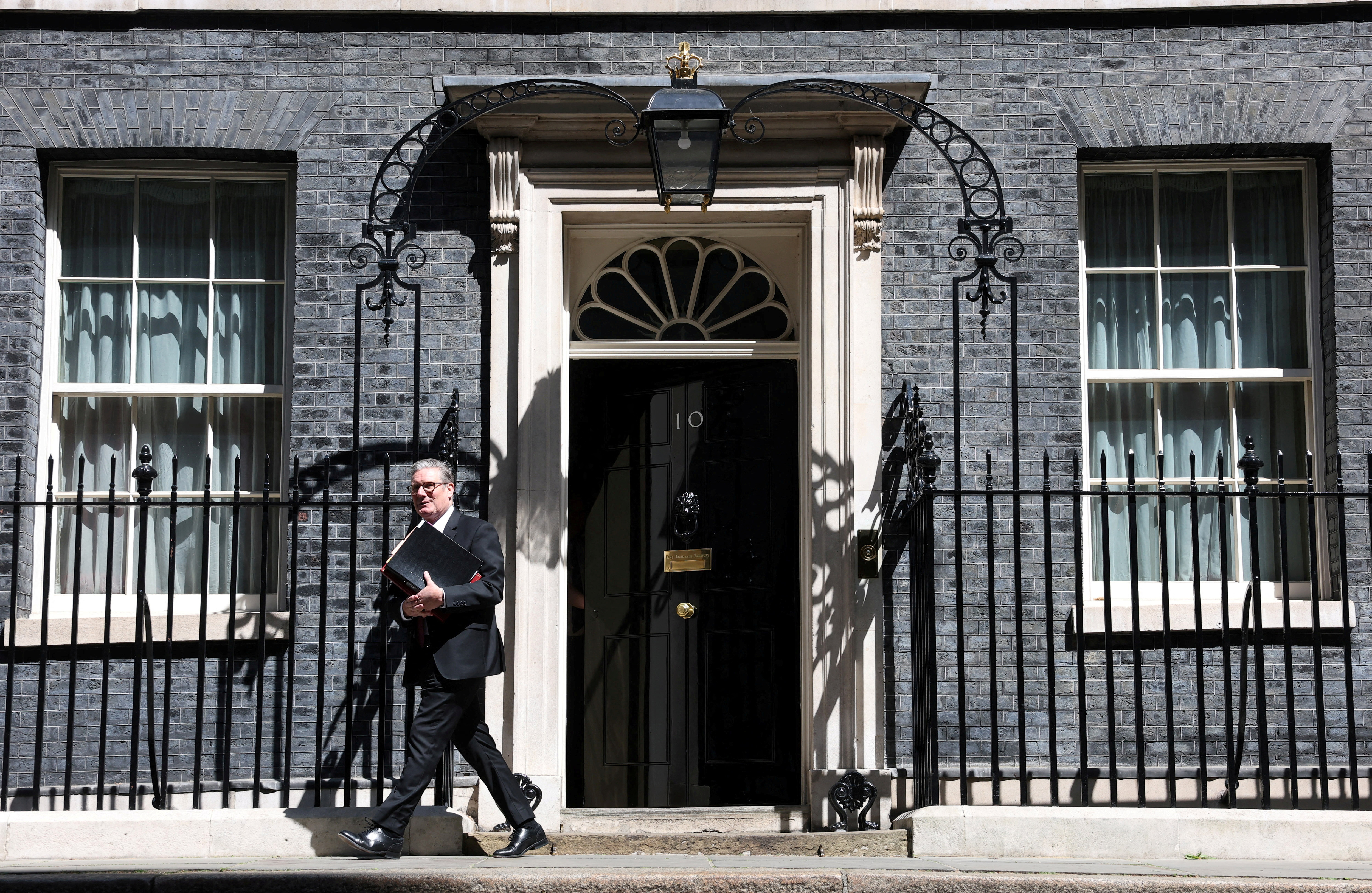 FILE PHOTO: British Prime Minister Starmer leaves 10 Downing Street in London