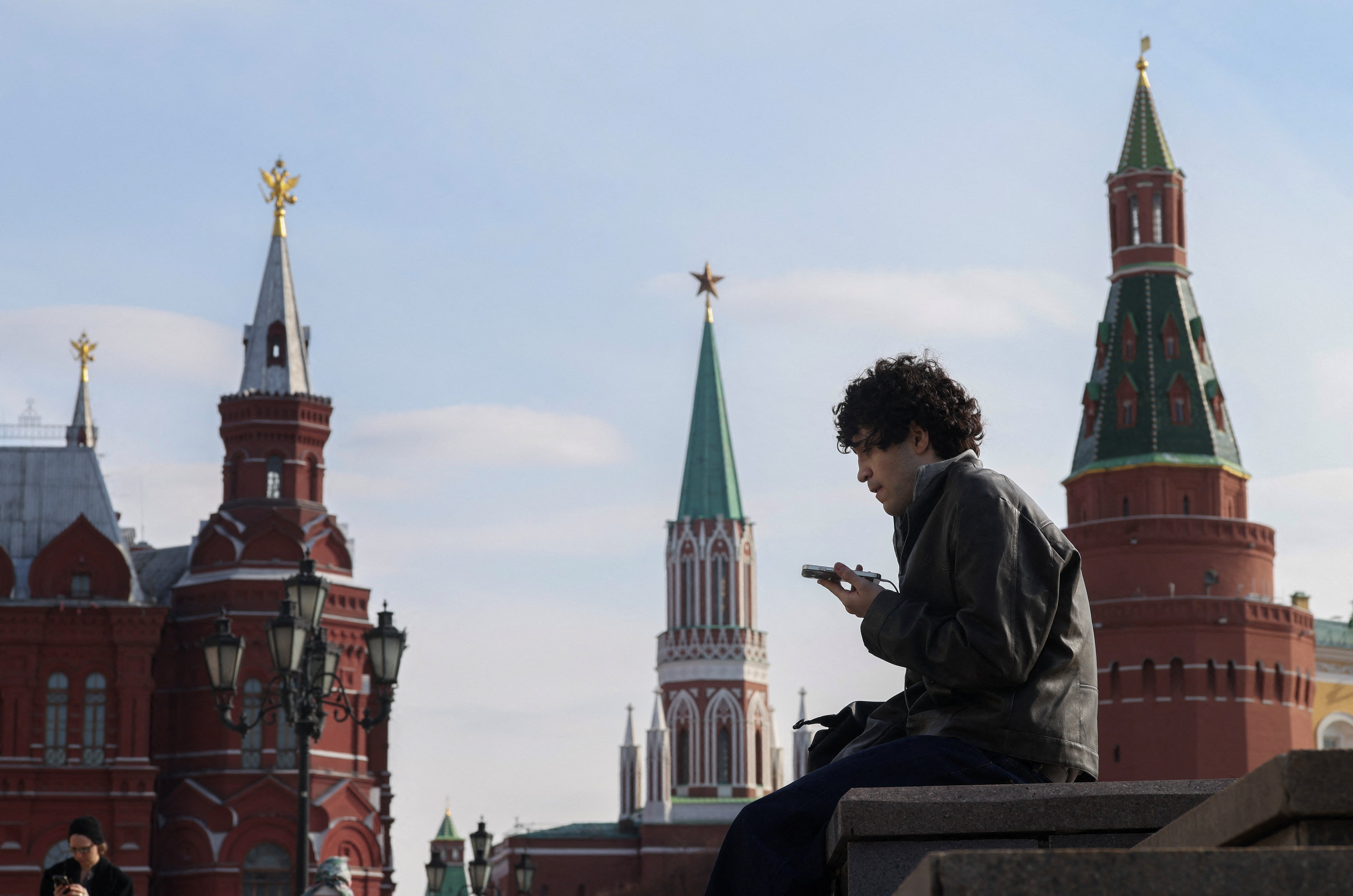 A man checks his mobile phone in central Moscow