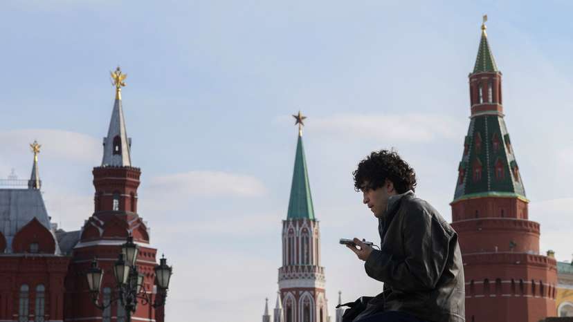 A man checks his mobile phone in central Moscow