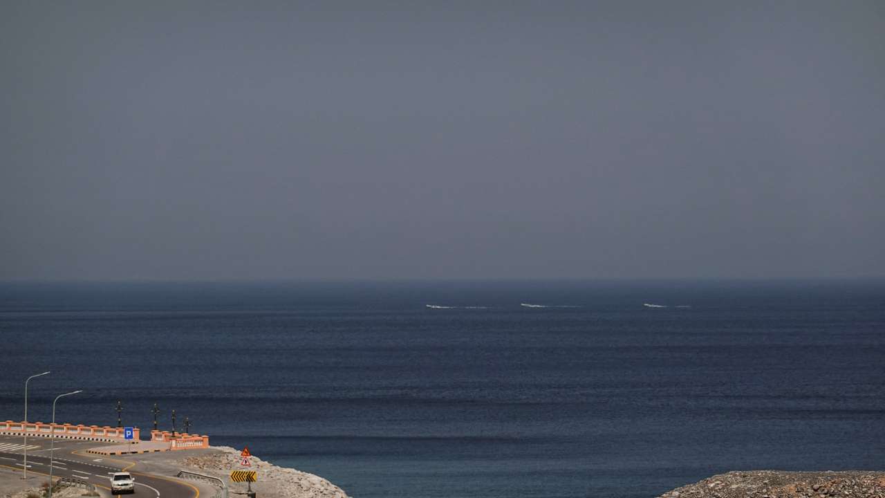 A car rides along the coast of Musandam overlooking the Strait of Hormuz amid the U.S.-Israeli conflict with Iran