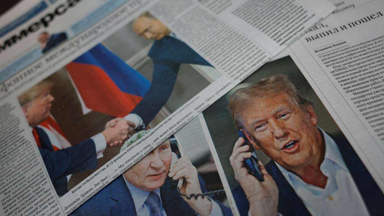 View of newspaper covers dedicated to Putin-Trump phone call at newsstand in Moscow
