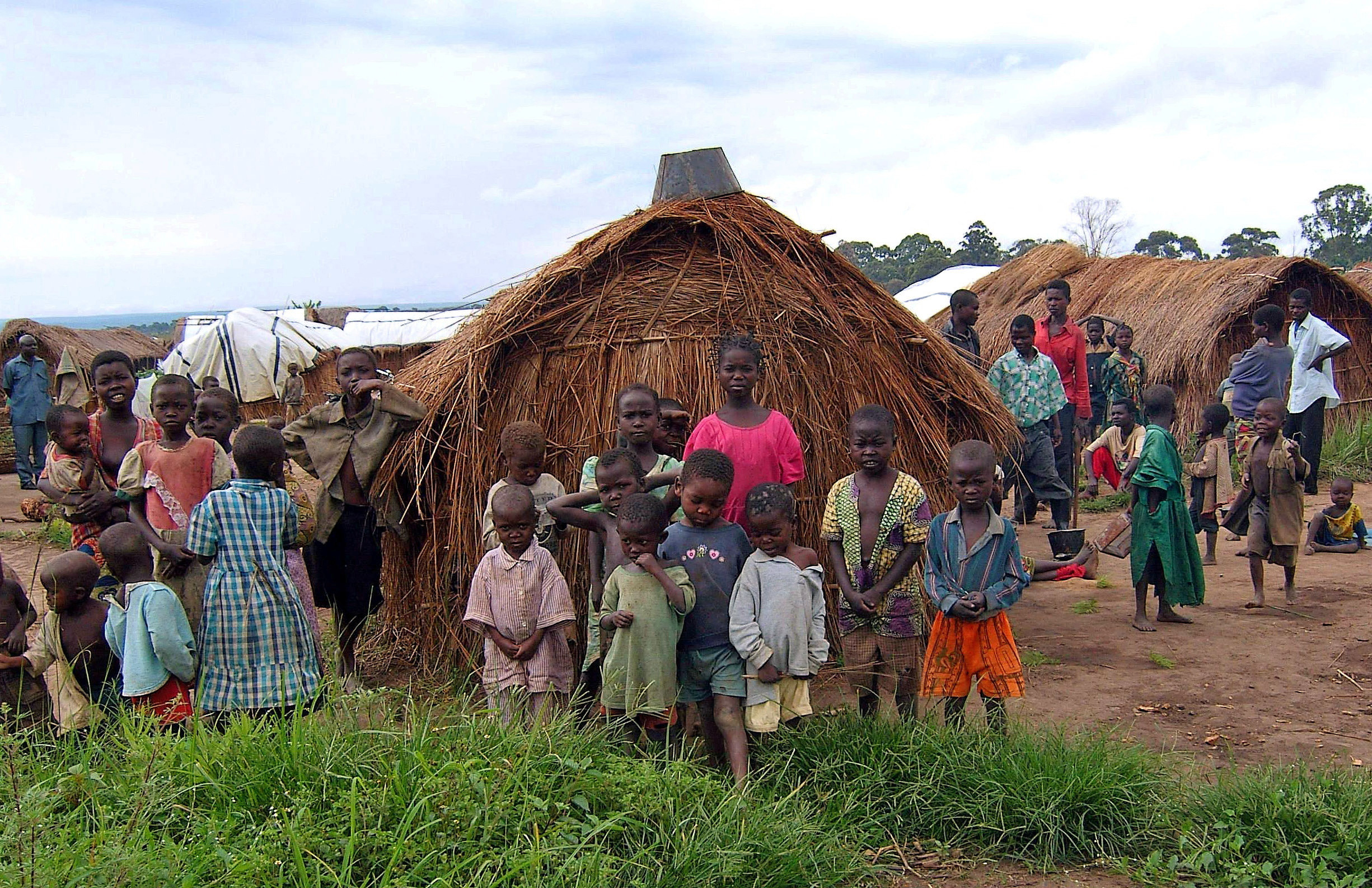 FILE PHOTO: Congolese children in Mitwaba camp for internally displaced people watch as a UN helicopter lifts off in Katanga