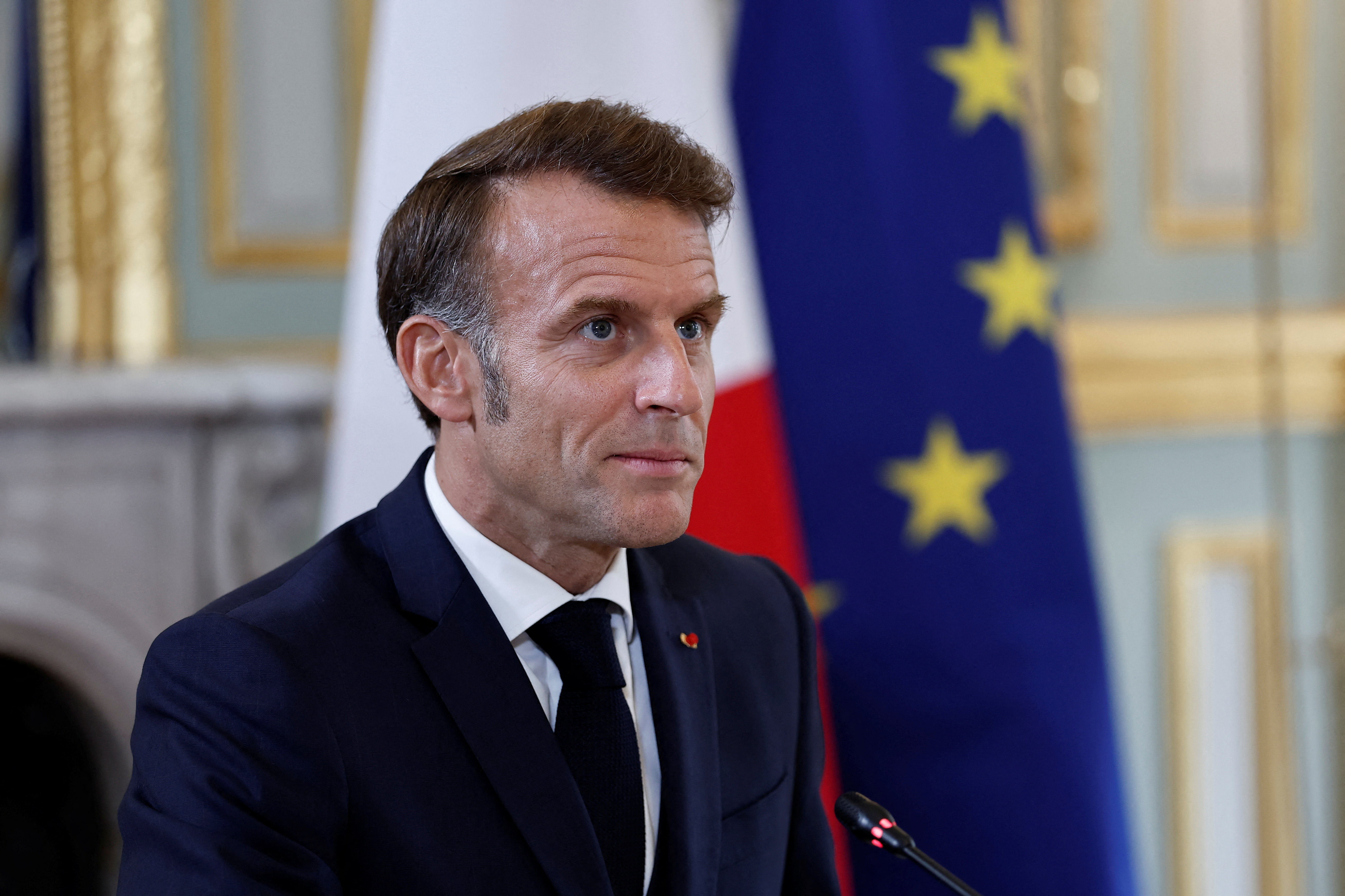 French President Macron attends a video conference on the situation in the Middle East, in Paris