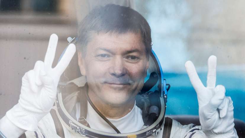 FILE PHOTO: Roscosmos cosmonaut Kononenko reacts in the bus just before the departure to the launchpad at the Baikonur Cosmodrome