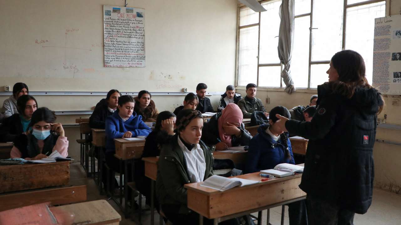 Students attend a class at a school in Qamishli