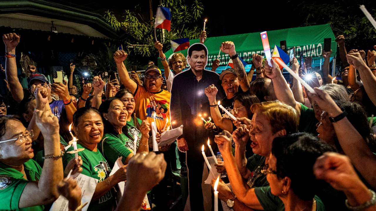 In custody in the Hague, on ballot at home: Duterte's grip on Philippines endures