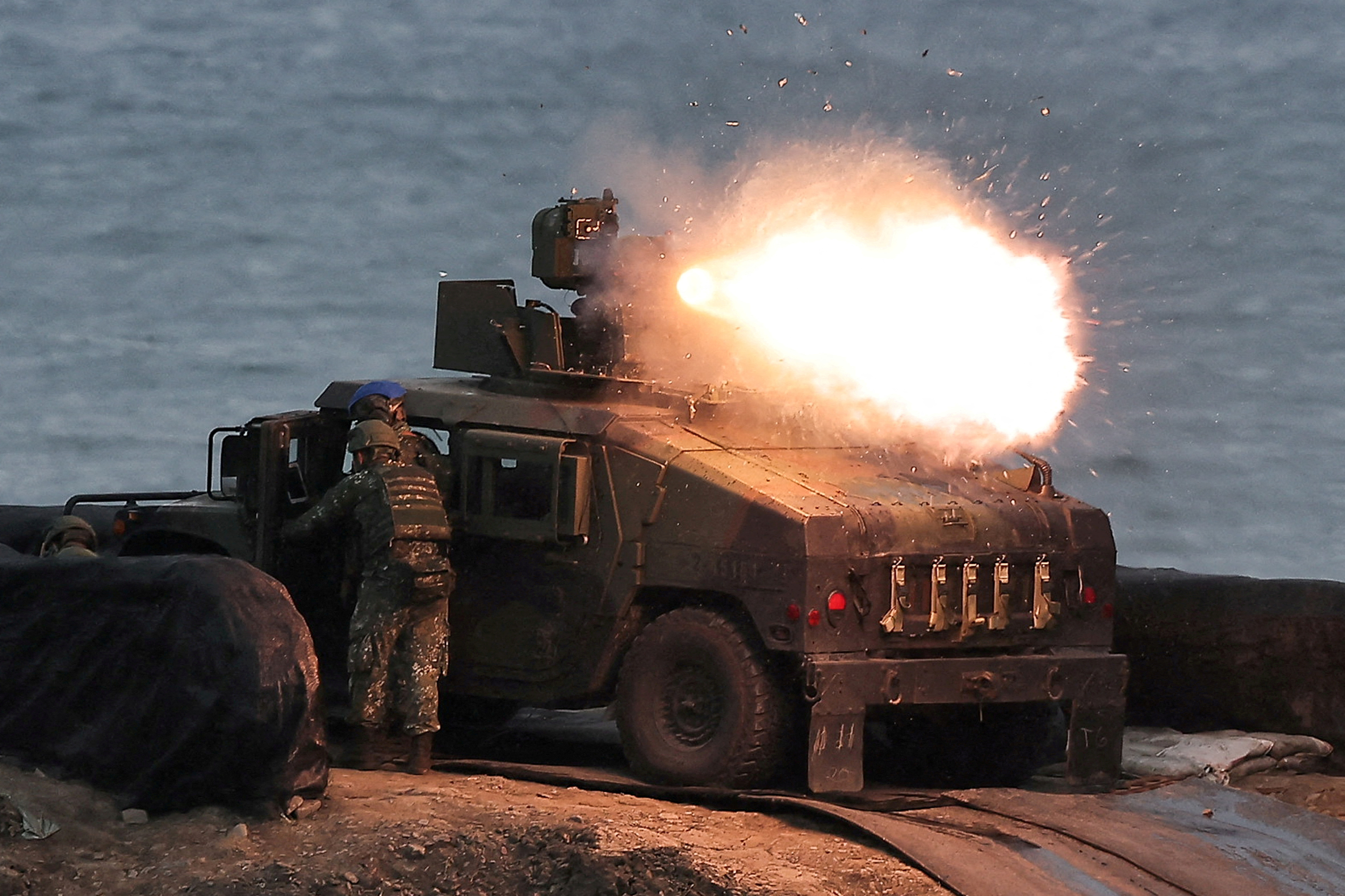 FILE PHOTO: A US-made TOW-2A wire-guided anti-tank missile launched by Taiwanese soldiers from a M1167 TOW carrier vehicle