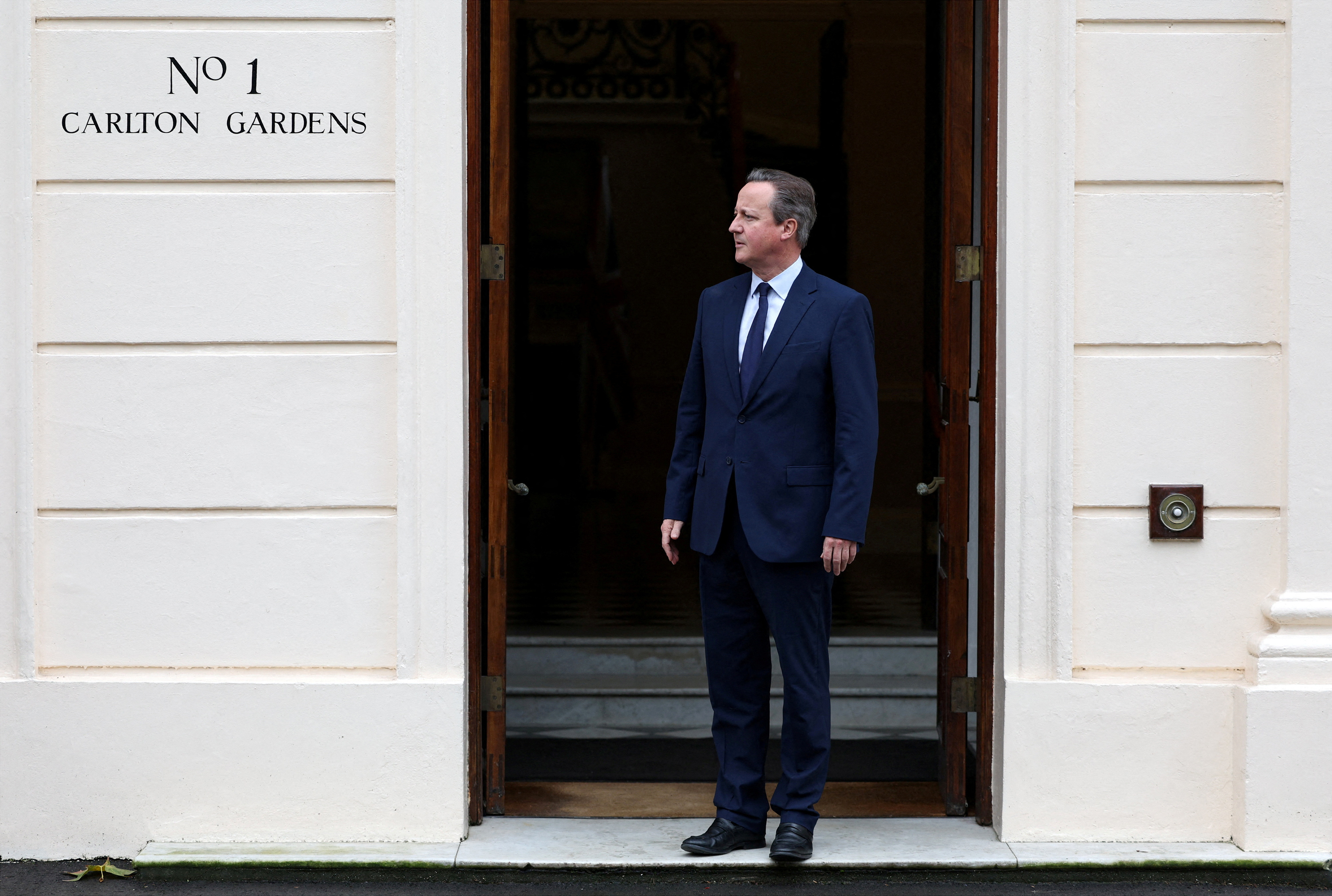 FILE PHOTO: Britain's Foreign Secretary David Cameron meets Ireland's Deputy Prime Minister and Foreign Minister Micheal Martin in London