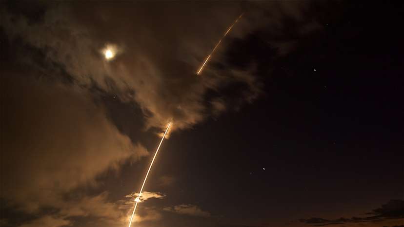 A medium-range ballistic missile target is launched from the Pacific Missile Range Facility, before being successfully intercepted by Standard Missile-6 missiles fired from the guided-missile destroyer USS John Paul Jones, in Kauai