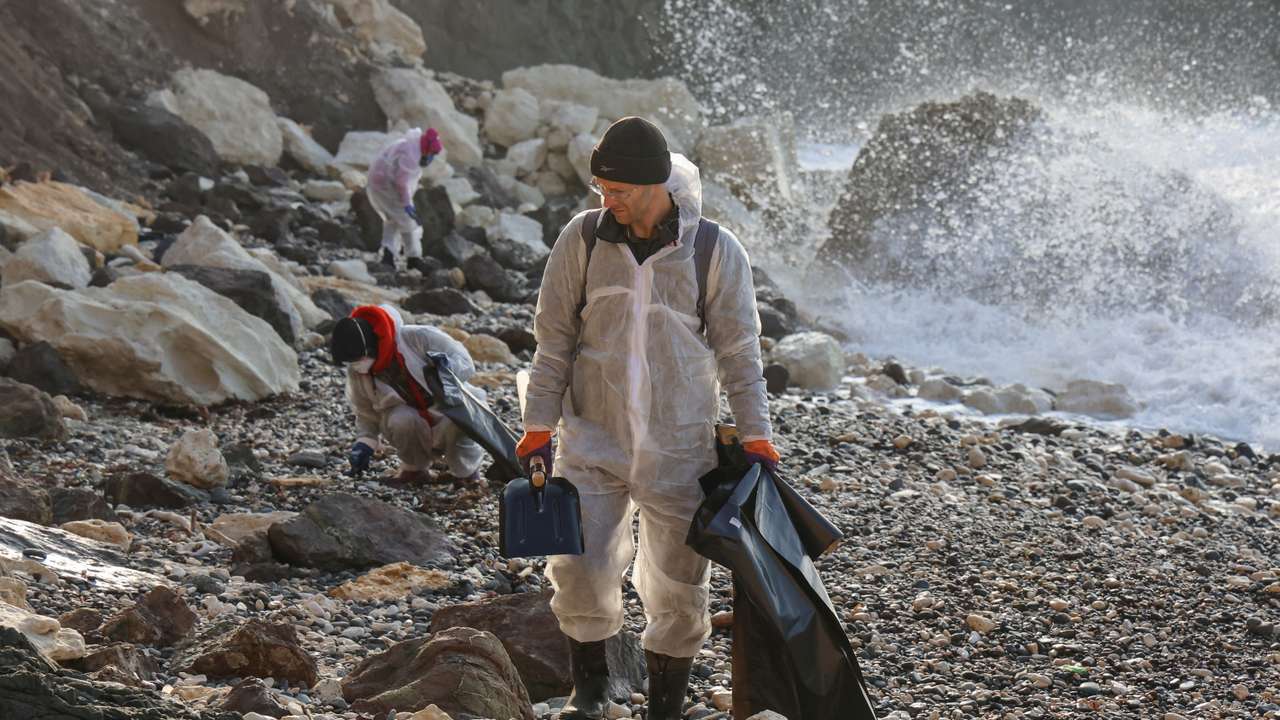 Volunteers work to clear spilled oil in Sevastopol, Crimea