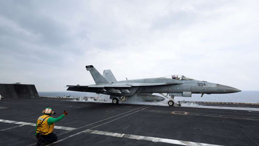 A F/A-18E Super Hornet fighter jet is catapulted off the flight deck of the USS Dwight D. Eisenhower (CVN 69) aircraft carrier in Southern Red Sea, Middle East