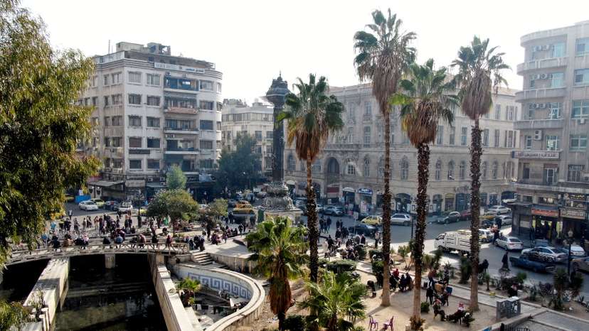A drone view shows people walking in Damascus