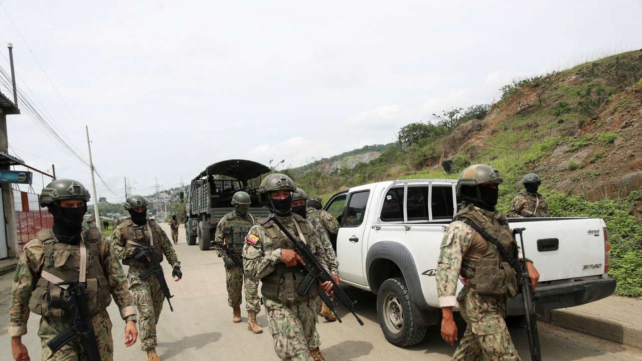Members of Security Forces check an area near the Zonal 8 prison, from where Jose Adolfo Macias alias "Fito" disappeared earlier in the month, in Guayaquil