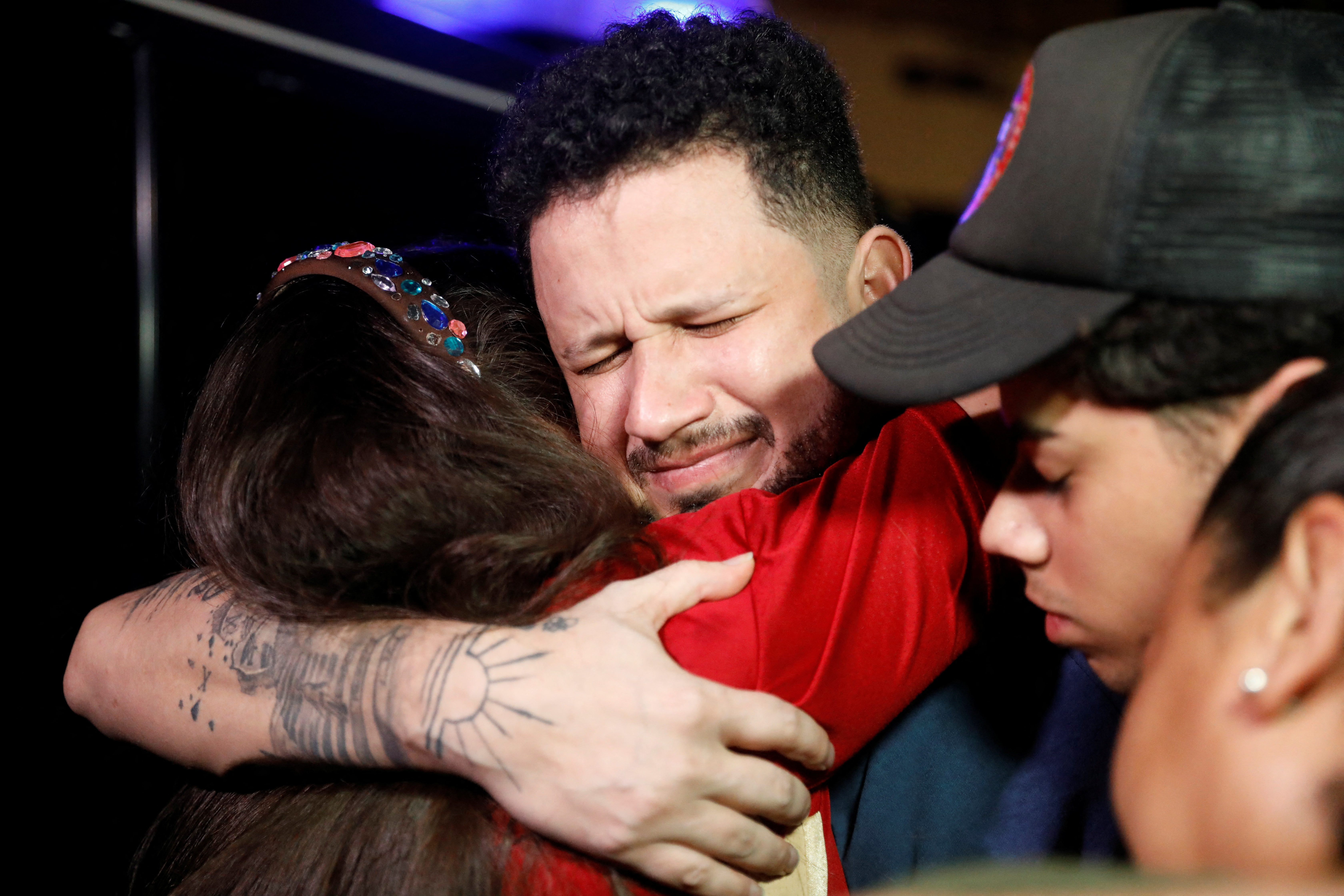 Arturo Suarez, who was held for months in an El Salvador prison, greets family members after his release, in Caracas