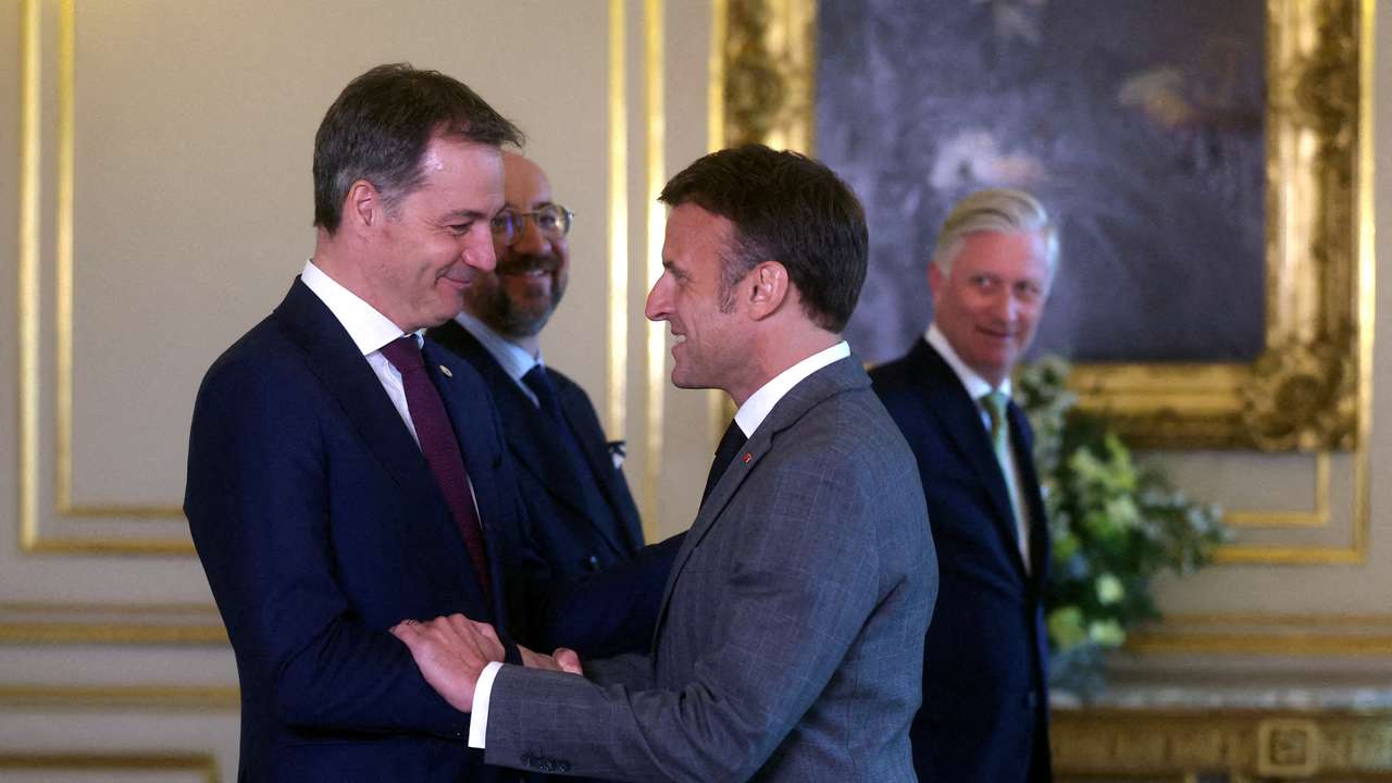 French President Emmanuel Macron is welcomed by Belgian Prime Minister Alexander De Croo