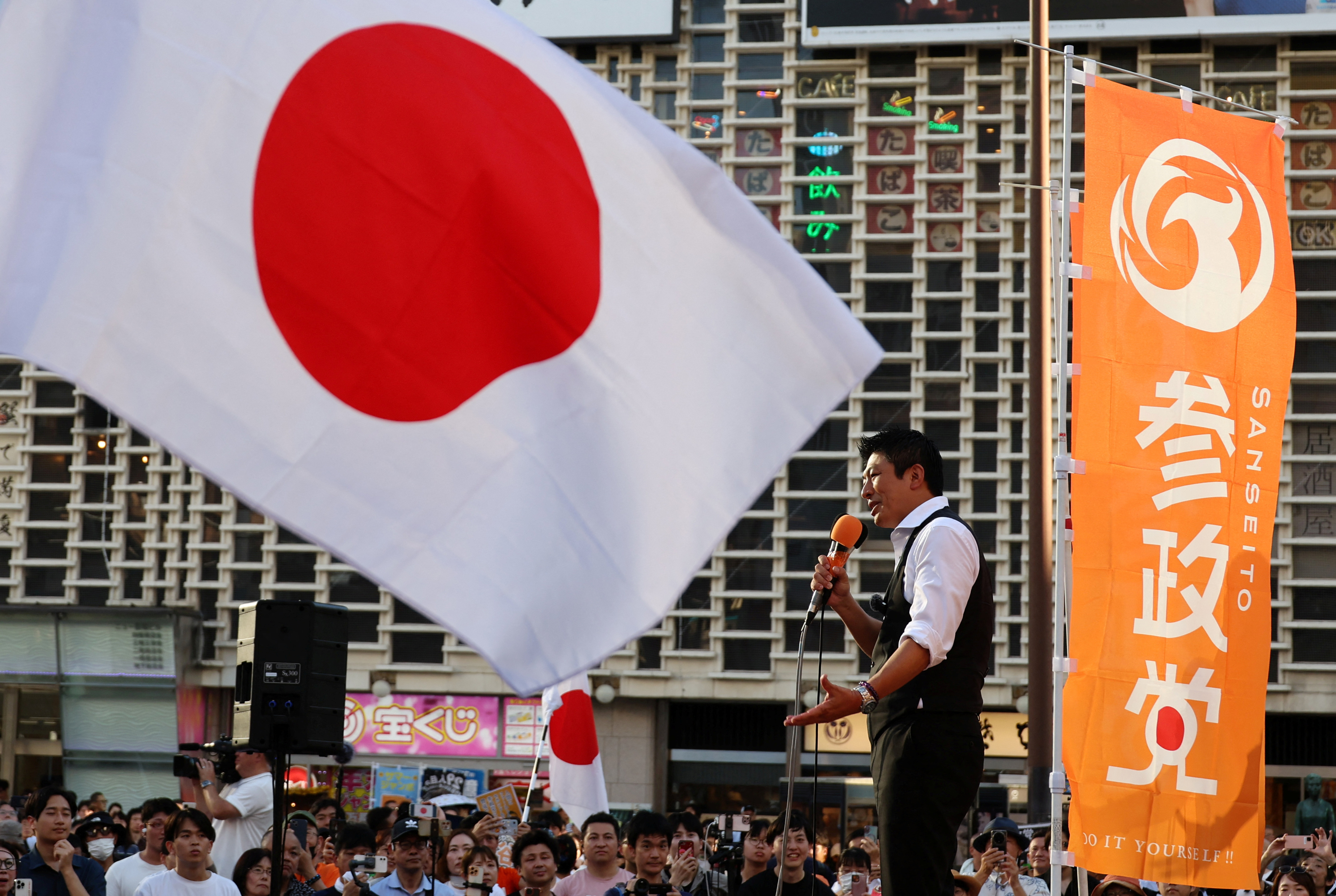 Japan's Sanseito party leader Sohei Kamiya delivers a speech during a party rally in Tokyo