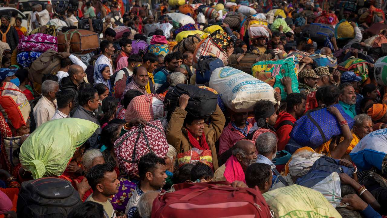 Devotees leave after attending the "Maha Kumbh Mela", in Prayagraj