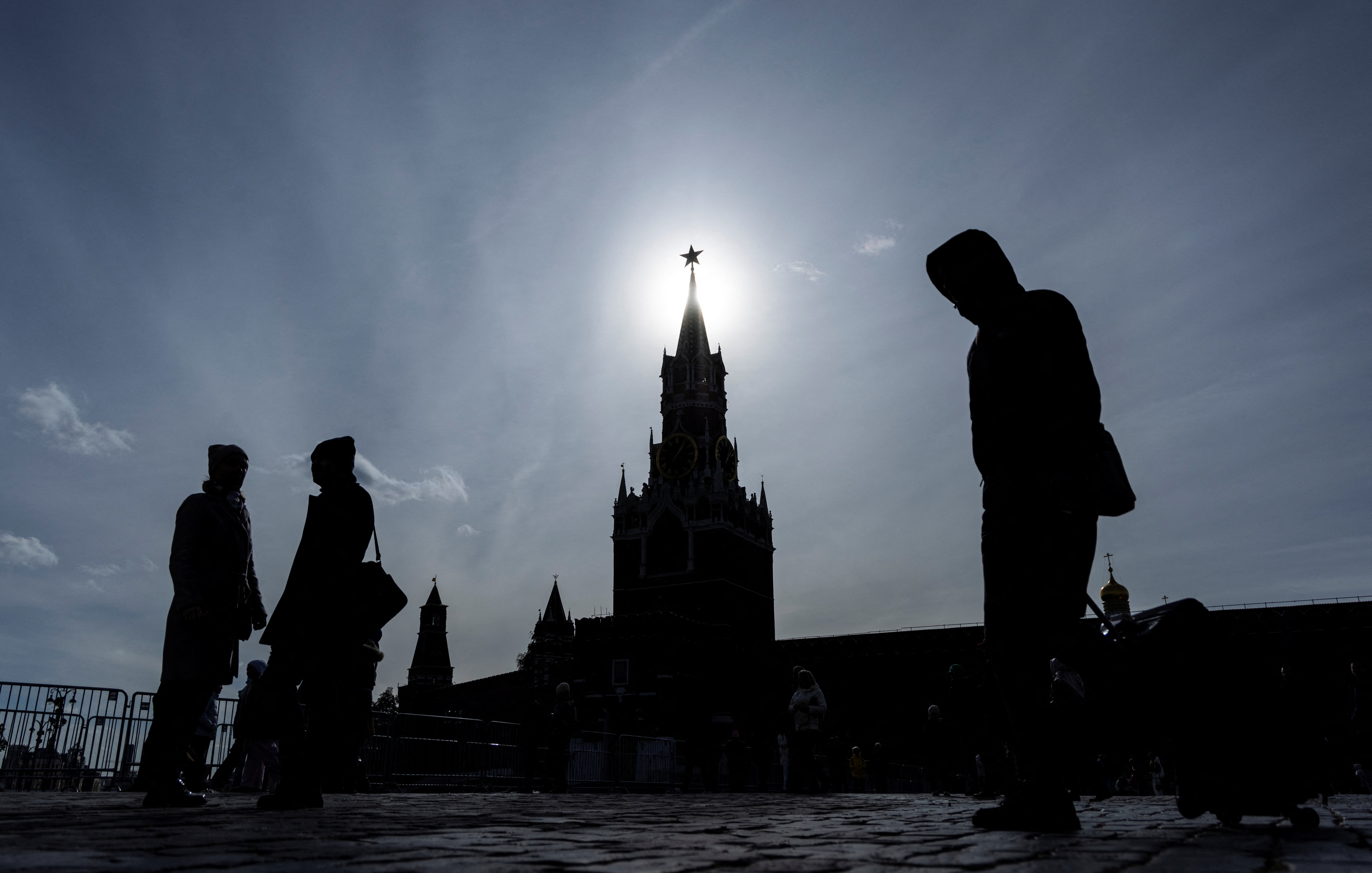 People walk in Red Square on a sunny autumn day in Moscow