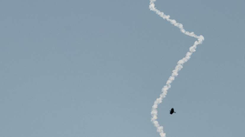 An interceptor missile leaves a smoke trail as seen from Tubas, in the Israeli-occupied West Bank