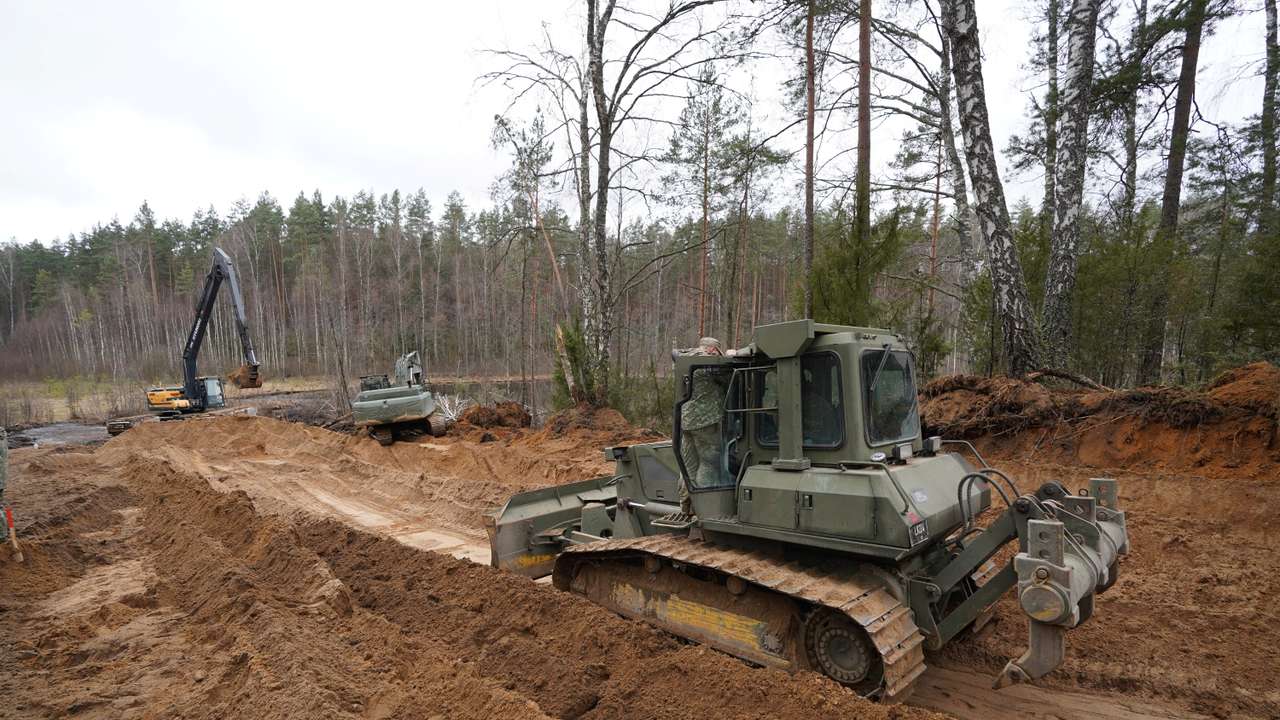 Rescuers dig for missing U.S. soldiers' vehicle in Lithuania