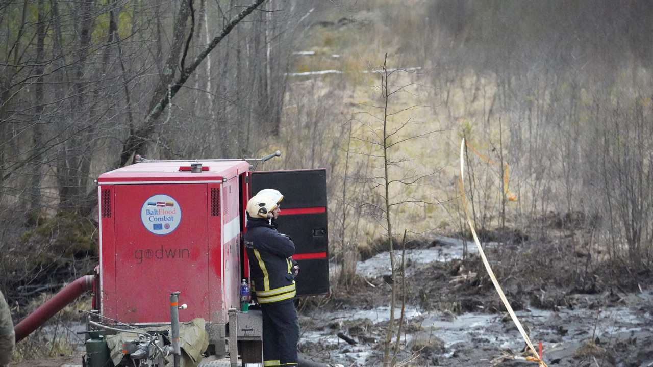 Rescuers dig for missing U.S. soldiers' vehicle in Lithuania