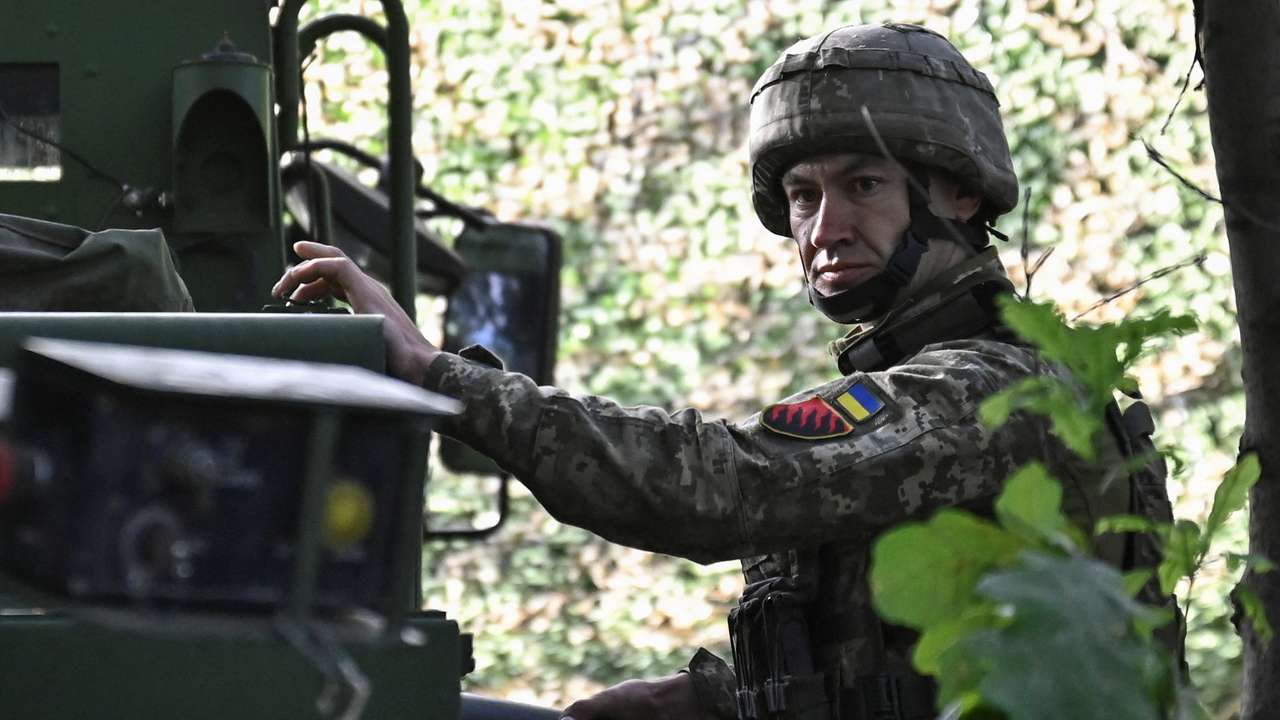 Ukraine serviceman holds a shell for a Caesar self-propelled howitzer before firing towards Russian troops outside the town of Pokrovsk