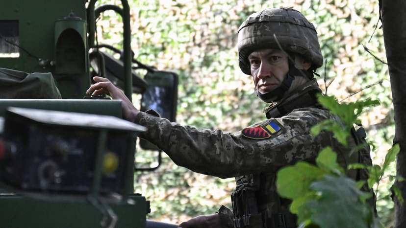 Ukraine serviceman holds a shell for a Caesar self-propelled howitzer before firing towards Russian troops outside the town of Pokrovsk