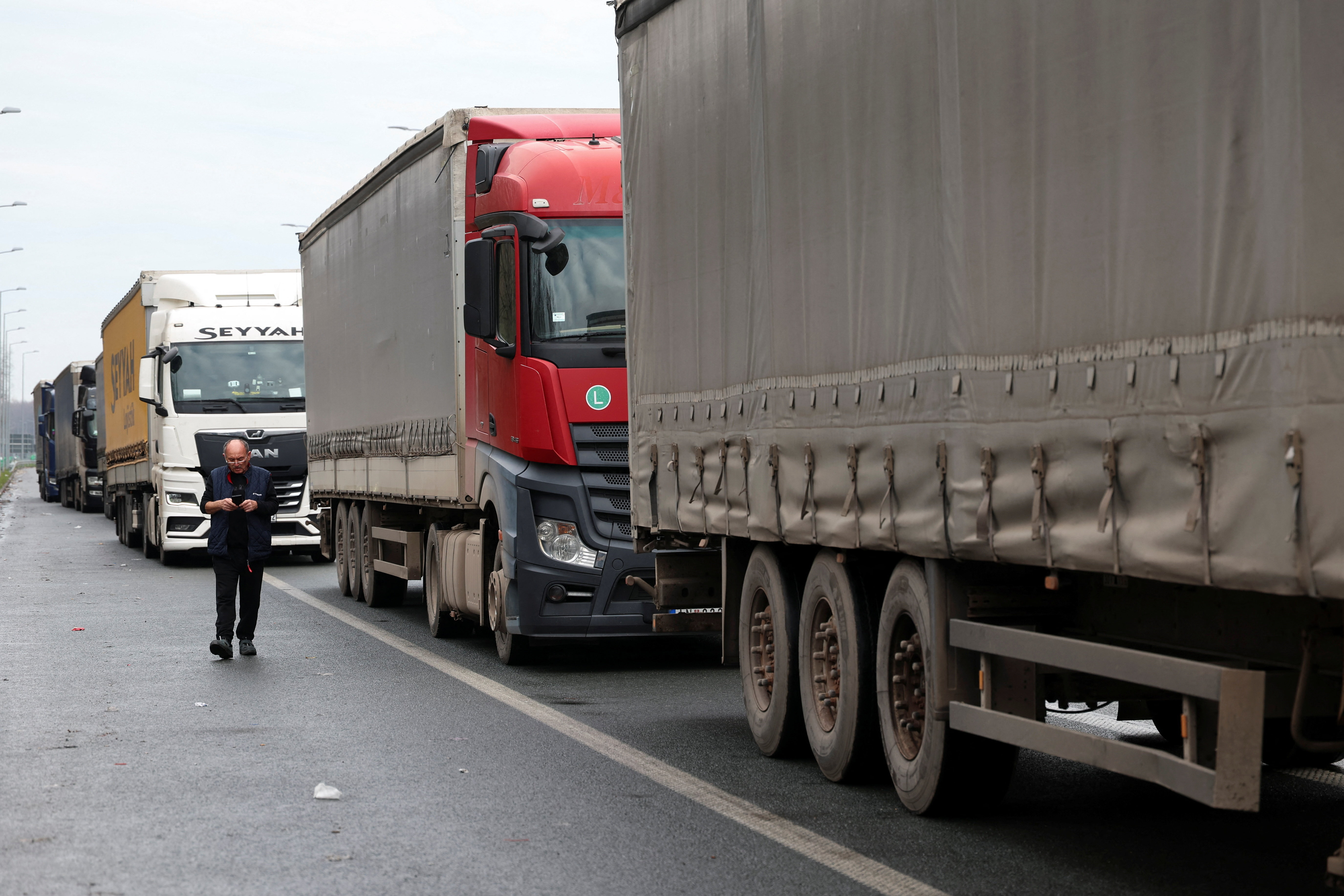 Truck drivers and transport union representatives protest at the Serbia-Croatia border crossings