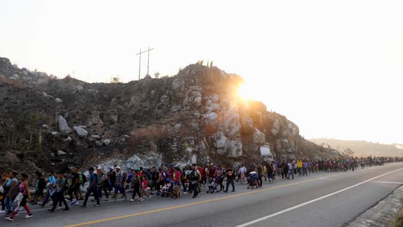 Migrants walk in a caravan as an attempt to reach the U.S. border, in Arriaga