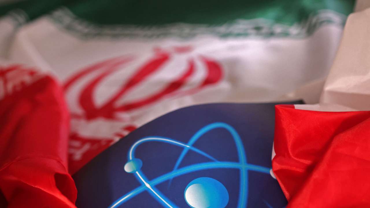 Illustration shows atomic symbol and Iranian flag