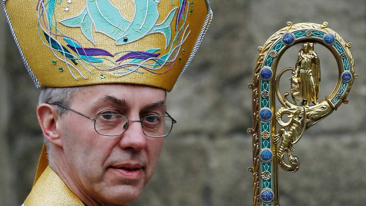 FILE PHOTO: The new Archbishop of Canterbury Justin Welby leaves after his enthronement ceremony at Canterbury Cathedral, in Canterbury, southern England