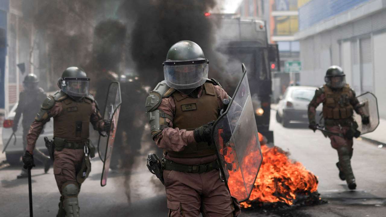 Demonstrators take part in a protest against a law being debated that would increase quotas for industrial fishing companies, in Valparaiso