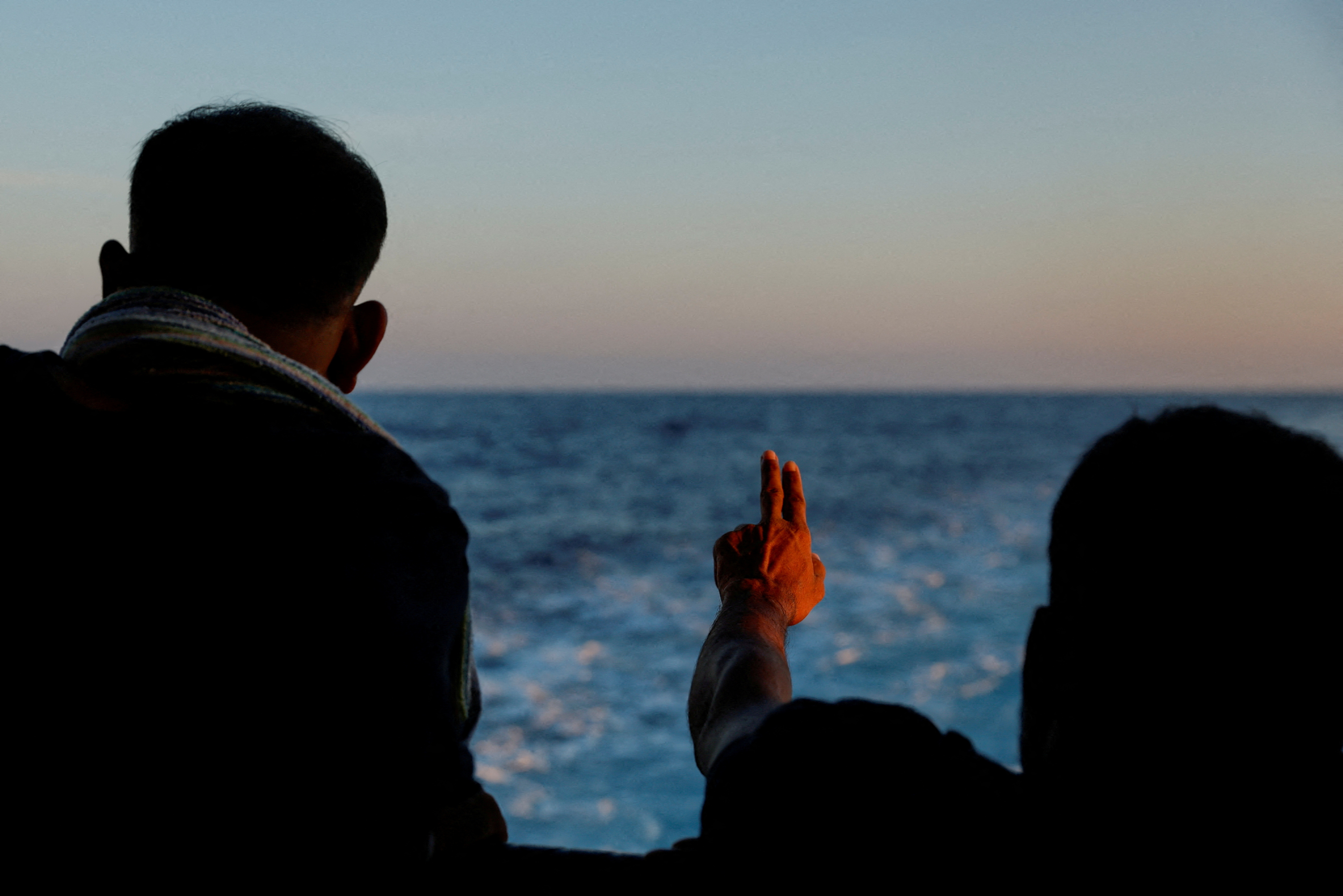 FILE PHOTO: Migrants on the Geo Barents migrant rescue ship, operated by Medecins Sans Frontieres (Doctors Without Borders)