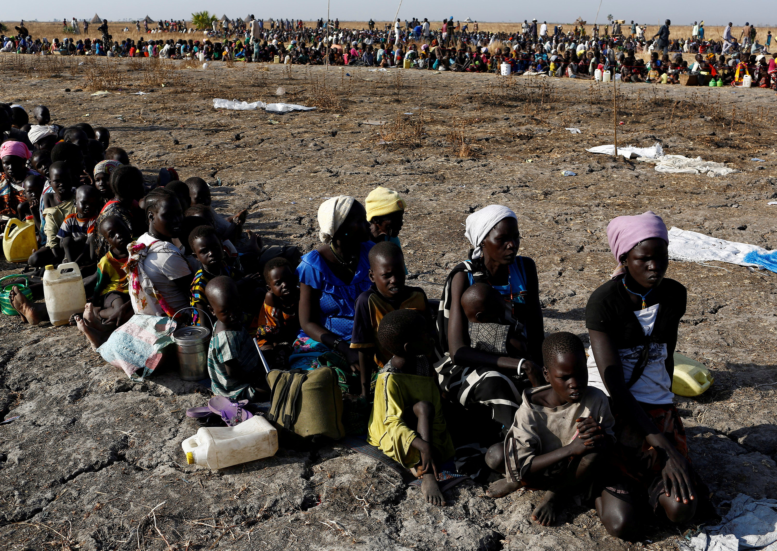 FILE PHOTO: Women and children wait to be registered prior to a food distribution carried out by the United Nations World Food Programme (WFP) in Thonyor, Leer state