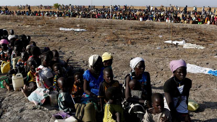 FILE PHOTO: Women and children wait to be registered prior to a food distribution carried out by the United Nations World Food Programme (WFP) in Thonyor, Leer state