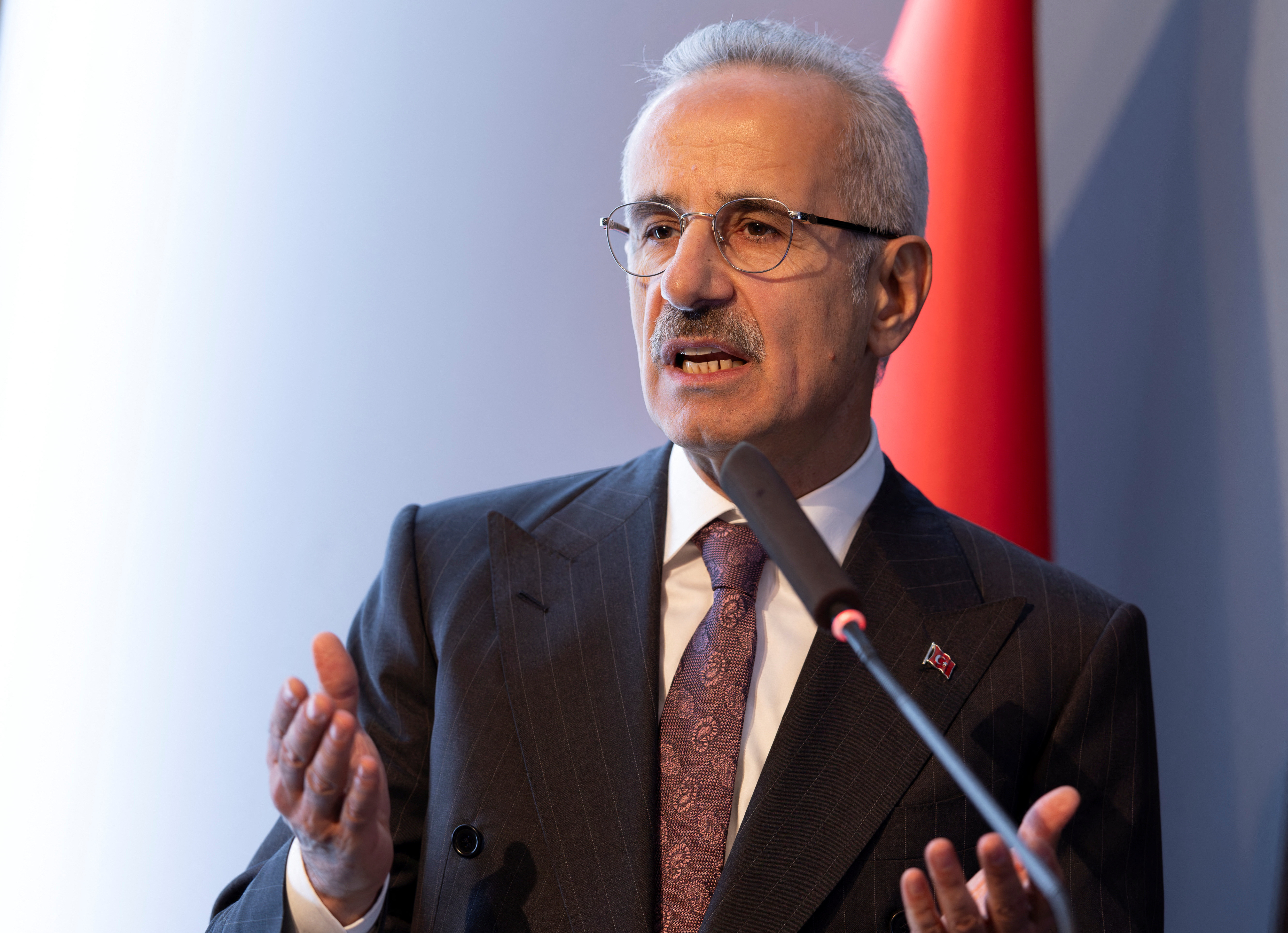 Turkey's Minister of Transport and Infrastructure Abdulkadir Uraloglu addresses the audience during a signing ceremony in Istanbul