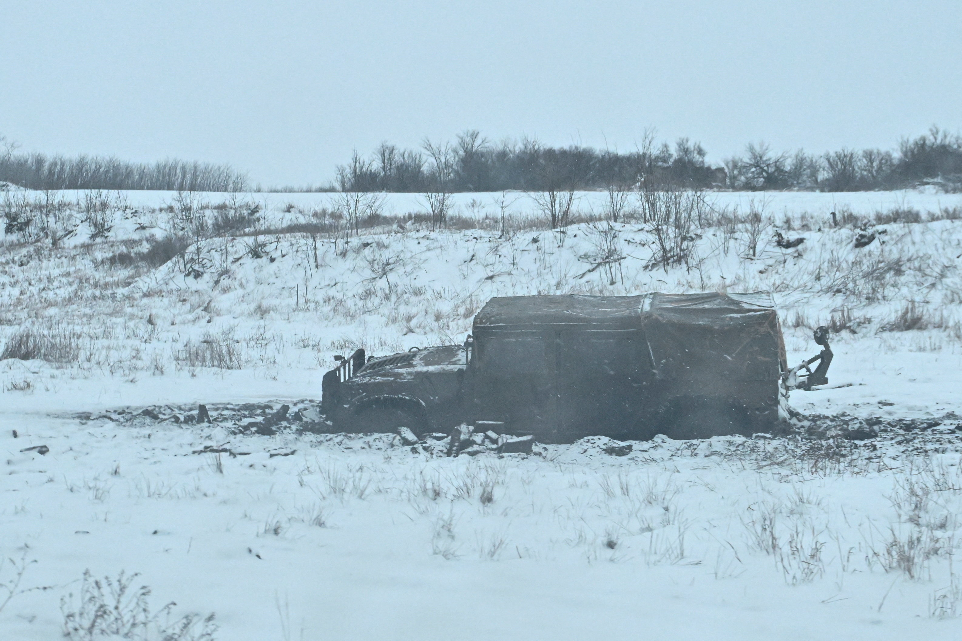 Humvee of Ukrainian servicemen stuck in mud near a front line in Zaporizhzhia region