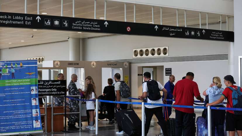 People wait in line at Lebanese customs at the Beirut–Rafic Hariri International Airport