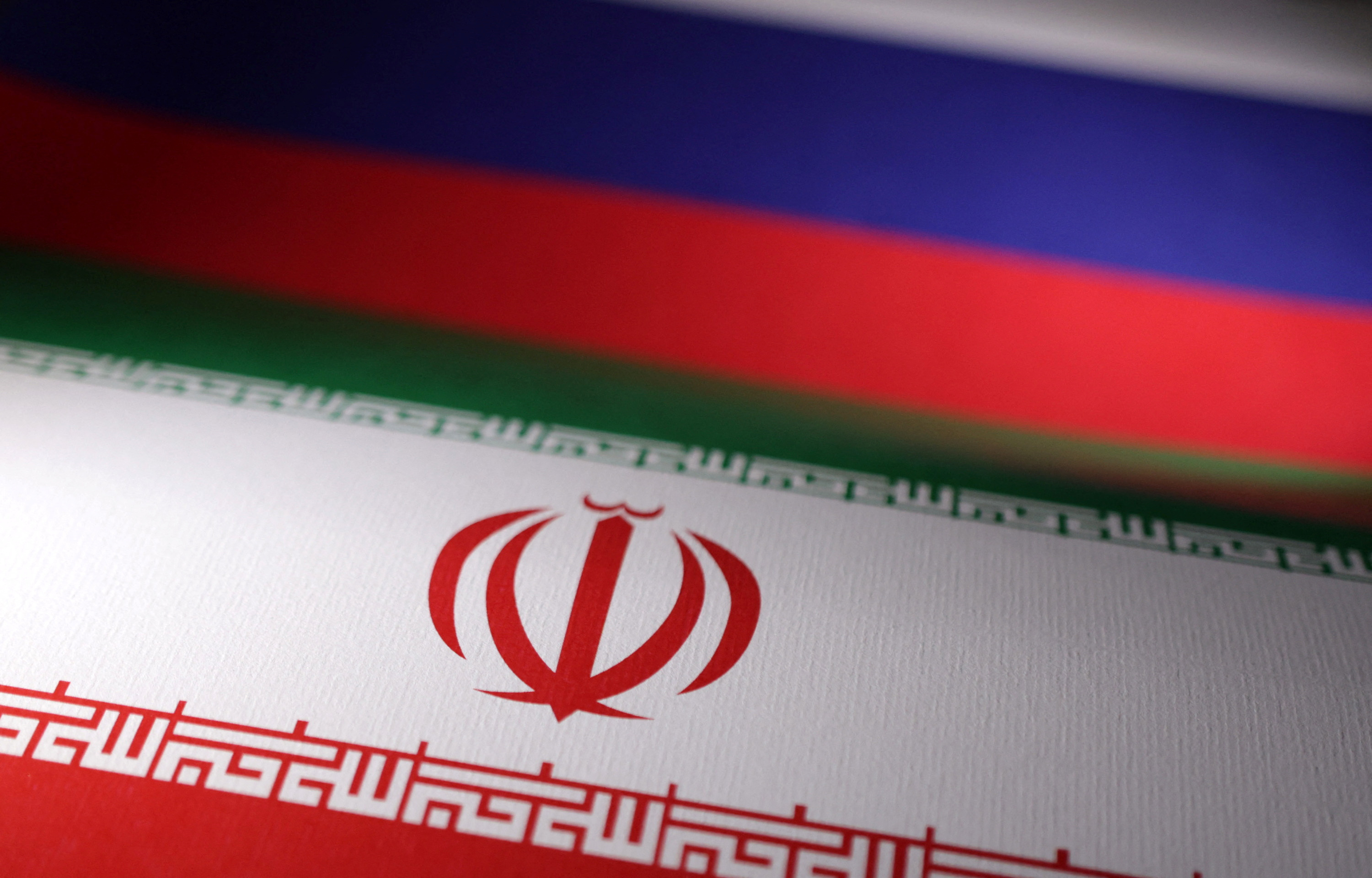 Illustration shows Iranian and Russian flags