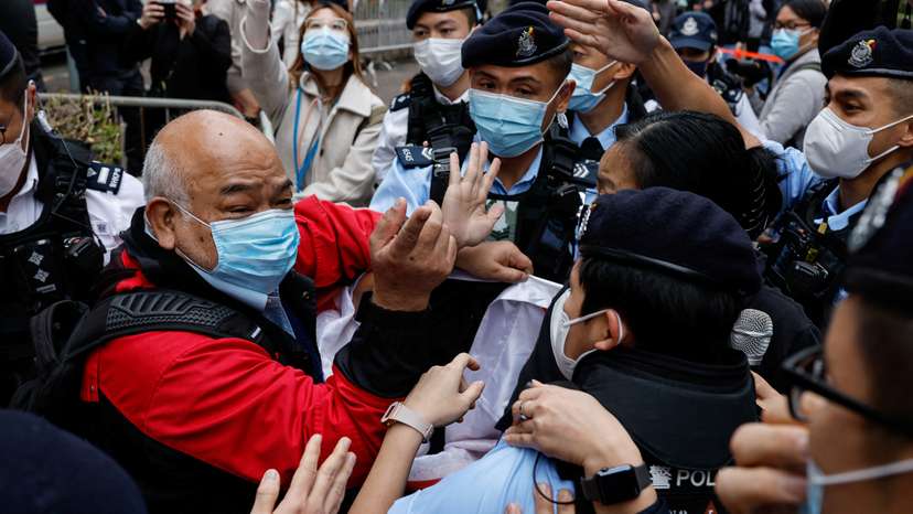 A supporter scuffles with police the West Kowloon Magistrates' Courts building during the hearing of the 47 pro-democracy activists charged with conspiracy to commit subversion under the national security law, in Hong Kong