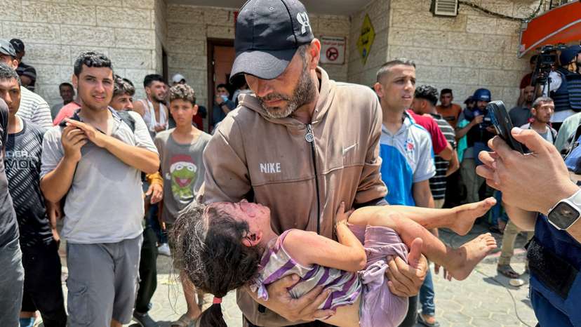 Palestinians wounded in an Israeli strike are brought to Al-Aqsa Martyrs Hospital, in Deir Al-Balah