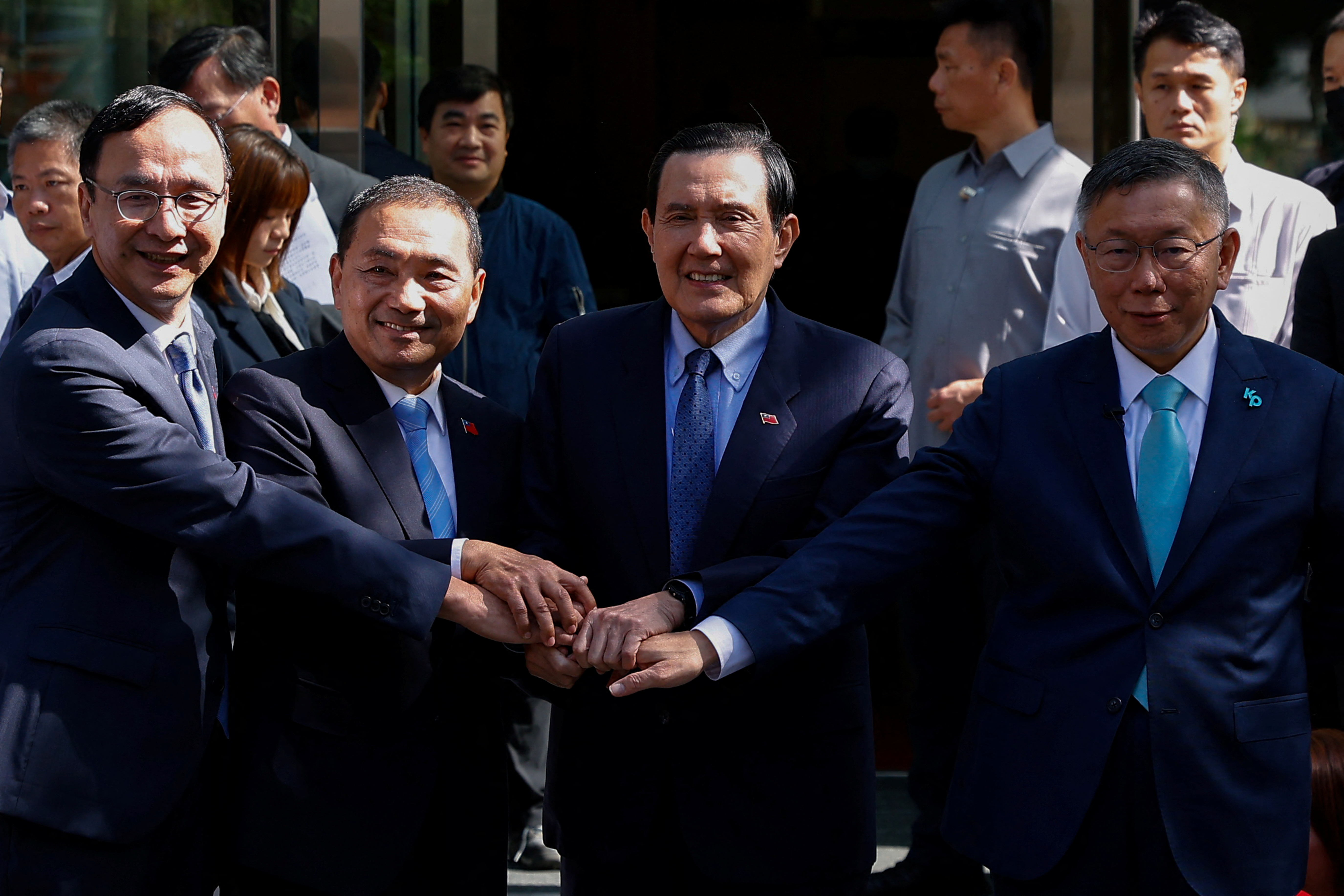 Taiwan's Kuomintang Chairman and Taiwan People’s Party Chairman pose for a group photo in Taipei