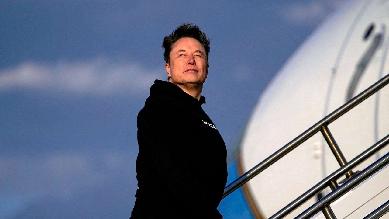 FILE PHOTO: Tesla CEO Elon Musk boards Air Force One in New Jersey