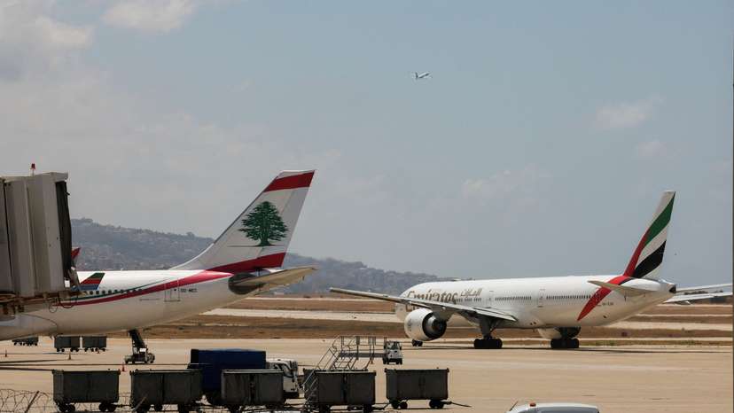 FILE PHOTO: Lebanese Middle East Airlines (MEA) and Emirates Airlines planes are pictured at the tarmac of Beirut-Rafic Al Hariri International Airport in Beirut