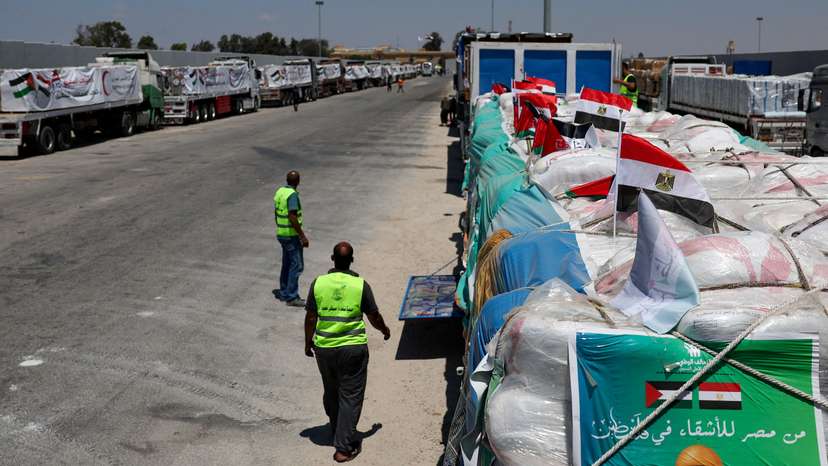 Trucks carrying humanitarian aid line up near the Rafah border crossing, in Rafah