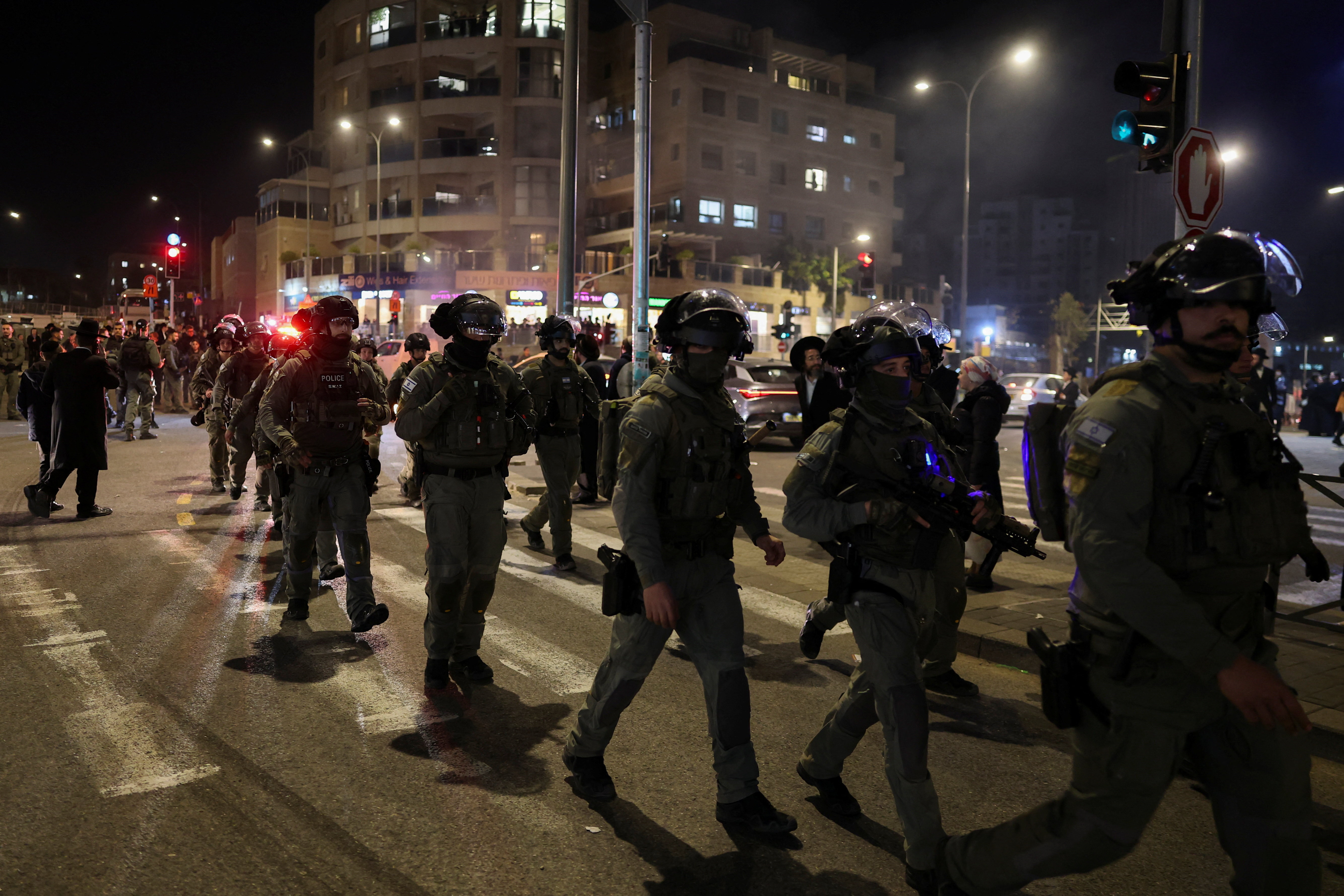 Israeli security forces secure the area, after, according to Israel's ambulance service, a person was killed in a collision involving a bus and several pedestrians, in Jerusalem