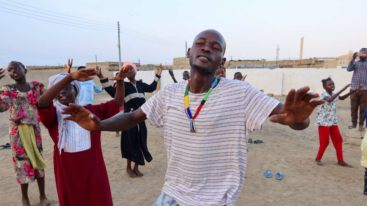 FILE PHOTO: General Kidi, a member of the Nuba Mountain Sound band, trains children to dance, in Port Sudan