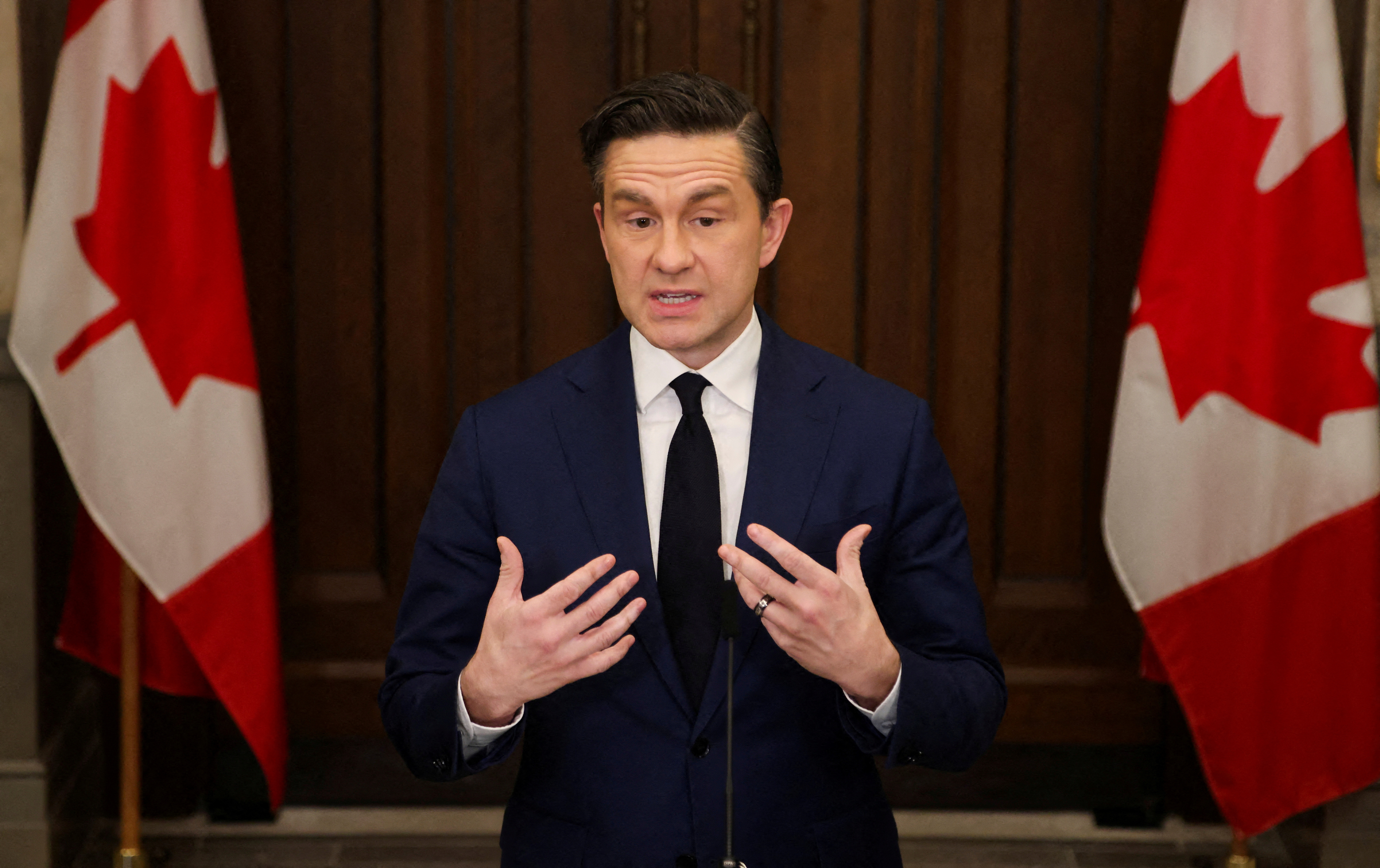 FILE PHOTO: Conservative Party of Canada leader Pierre Poilievre speaks at a press conference on Parliament Hill in Ottawa