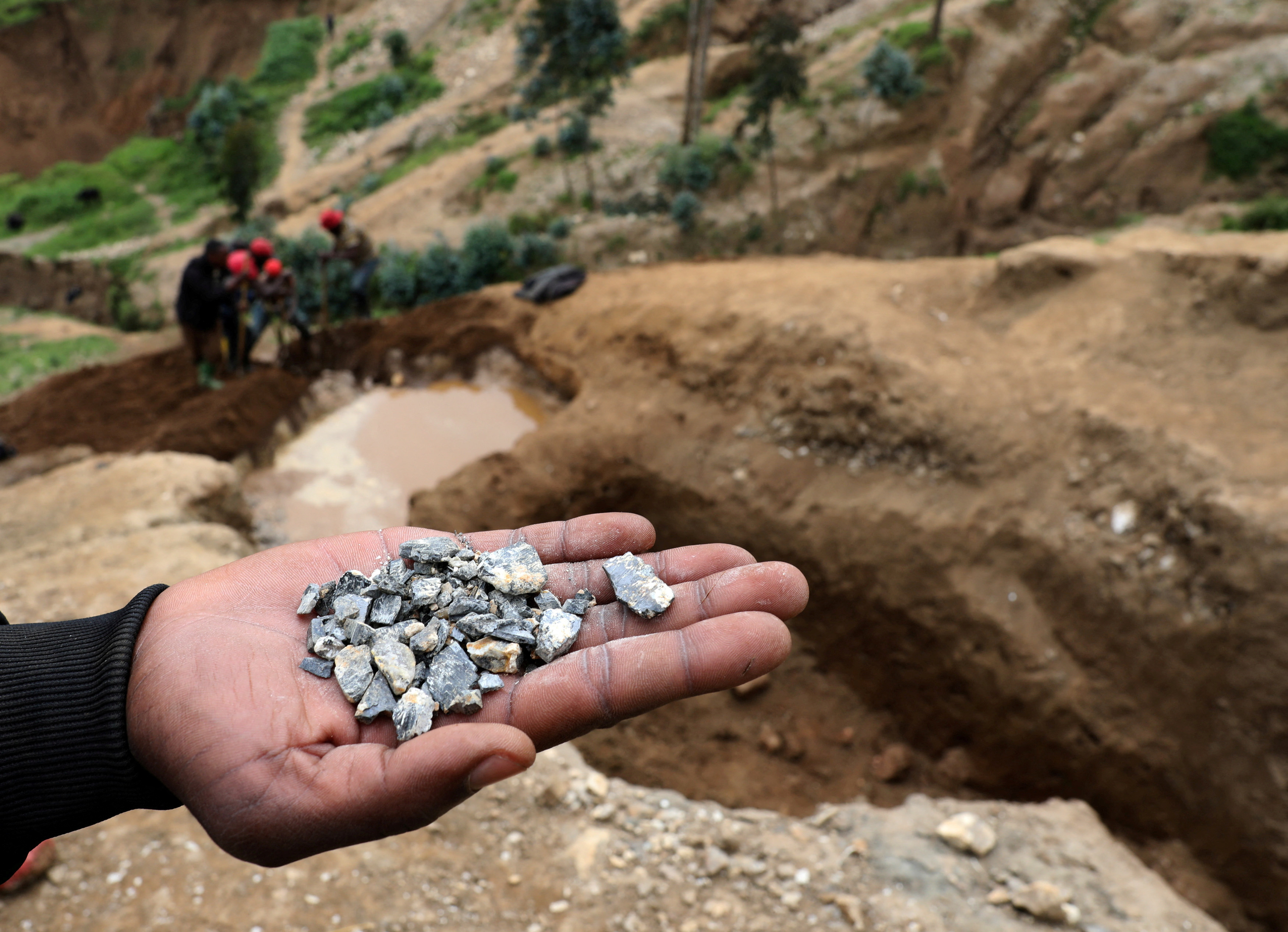 FILE PHOTO: A miner shows coltan in Birambo, Masisi territory, North Kivu Province of Democratic Republic of Congo