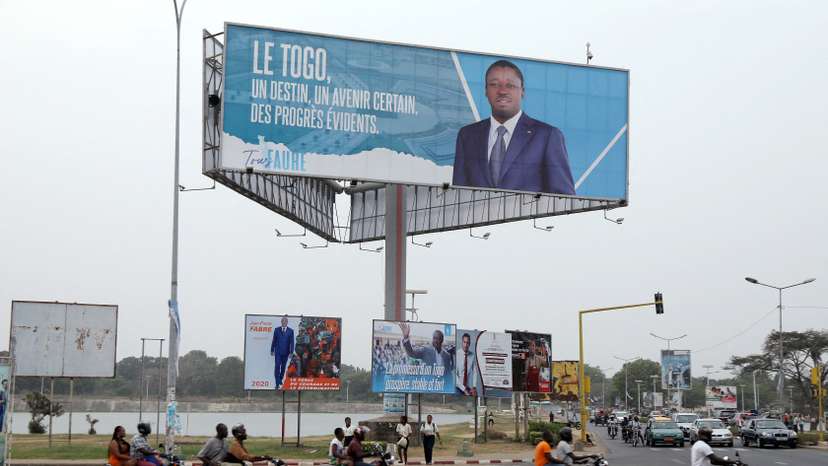 FILE PHOTO: A billboard of presidential candidate of UNIR Gnassingbe is pictured on a street in Lome